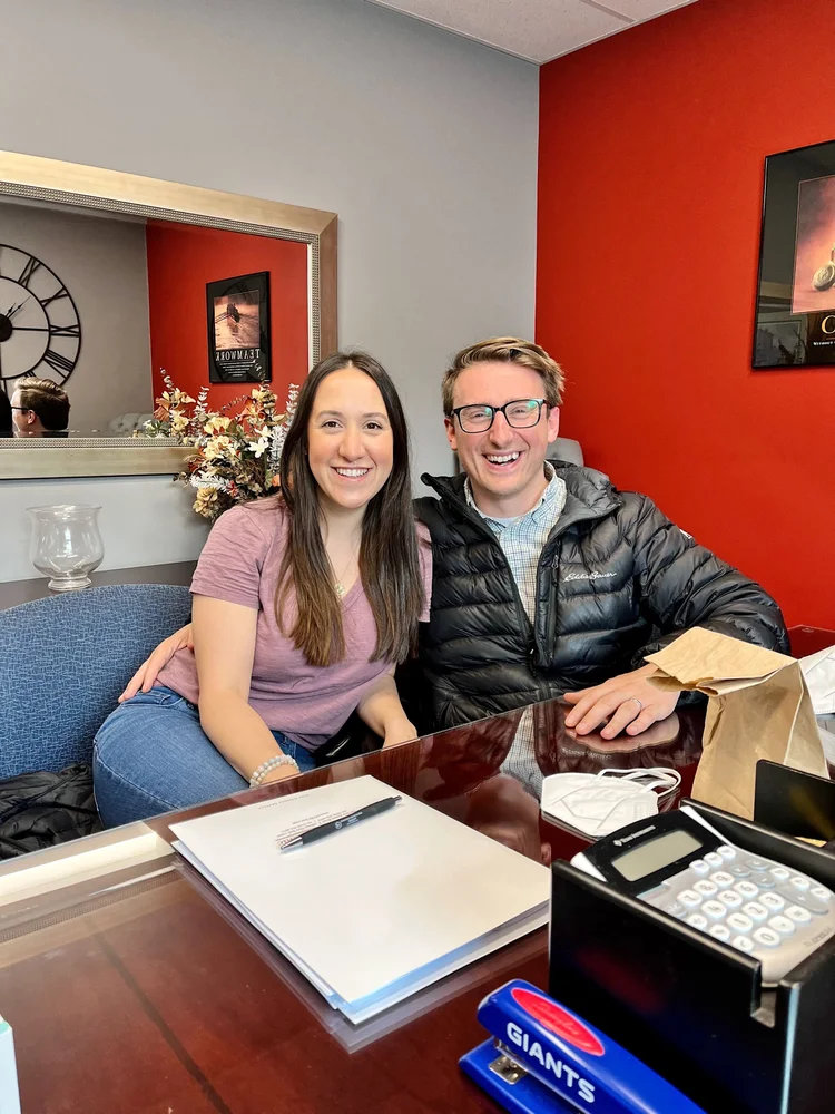 Ali and Josh smiling together, from their 2022 story